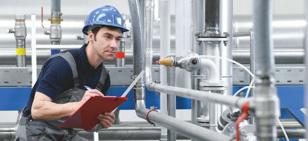 Industrial-trades-pipe-steam-fitting-category-man-looking-pipes